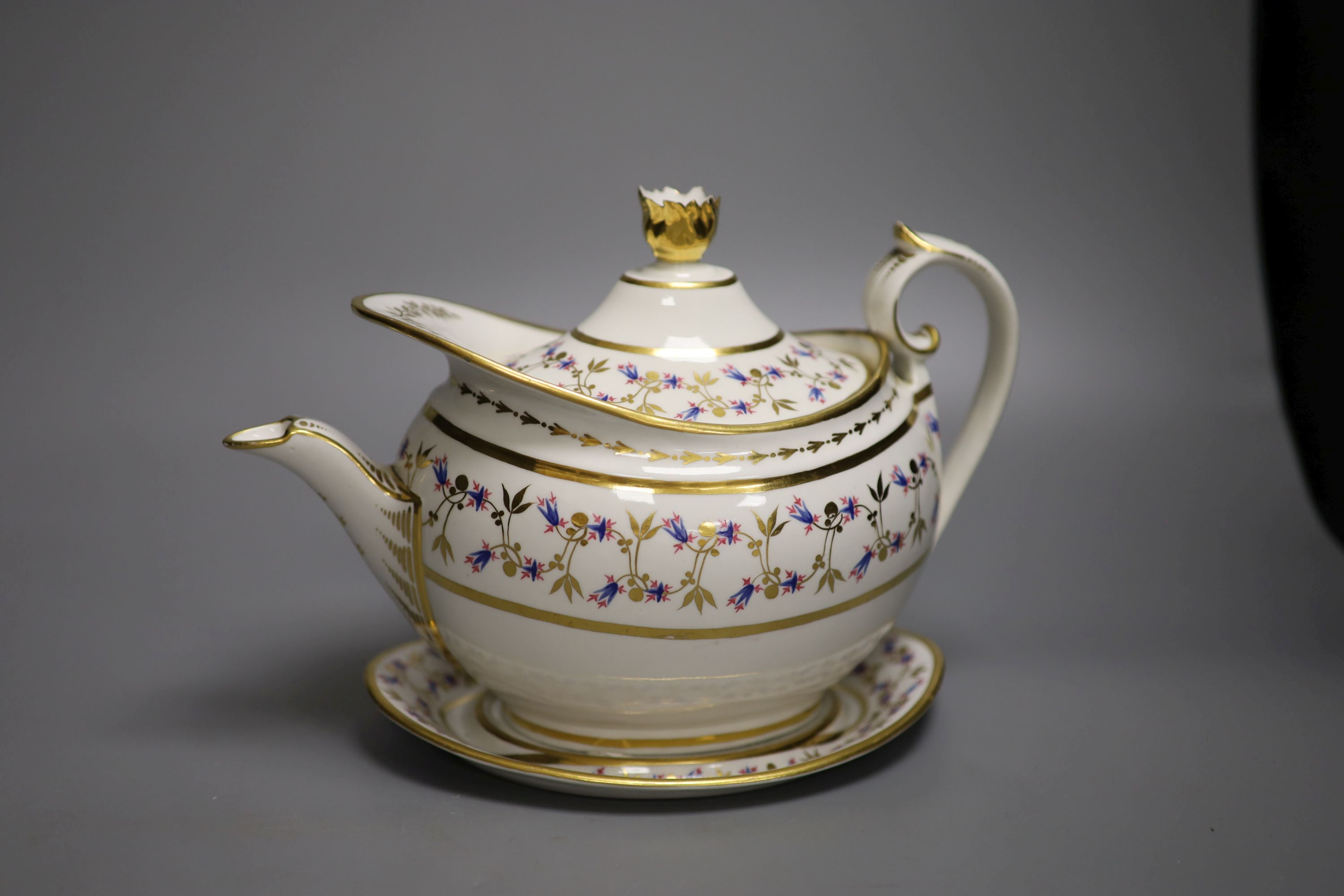 A Flight Barr and Barr teapot cover and stand, painted with cornflowers?, impressed mark to stand crown FBB, c.1825, height 18cm